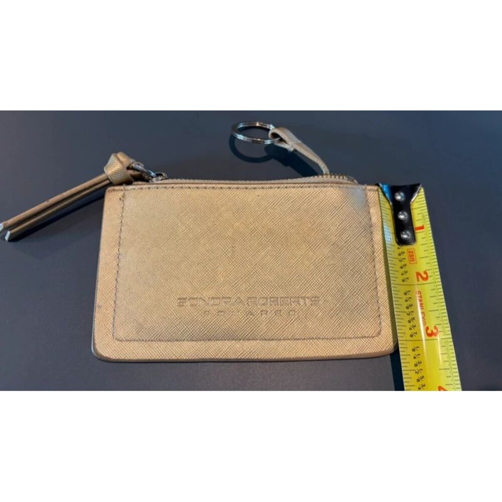 Gold Credit Card Holder Wallet Flaw Penmark on the left front side.